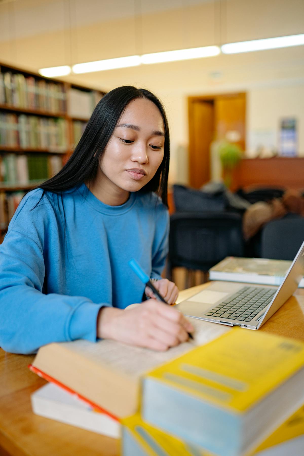 College student in dorm room on laptop for a video call